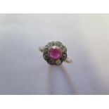 An 18ct yellow gold and platinum cabouchon ruby / spinnel and diamond daisy ring, size M/N, head
