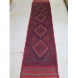 A hand knotted woollen Meshwani Runner, 245cm x 64cm, in good condition