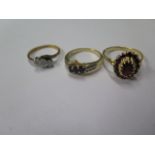 Two hallmarked 18ct yellow gold rings, sizes L and N/O, and an 18ct garnet ring, size S marked