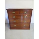 A circa 1900's ash chest of 2 over 3 graduated drawers on a plinth base with oval brass and loop