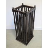 An early and unusual oak umbrella stick stand, the sides with alternating flat splats and bobbin