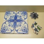 Four blue and white Angel tiles, 15cm x 15cm, some chipping, an Iznik design tile fragment and a
