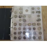 An album of silver threepenny pieces and 6 x penny and threepenny coins dating from George II