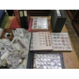A large collection of World coinage in 7 albums and loose