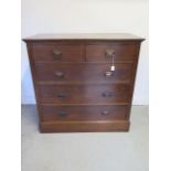 A circa 1900's oak Arts and Crafts chest of drawers of 2 over 3 graduated drawers on a plinth base