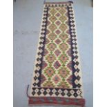 A hand knotted woollen Chobi Kilim Runner, 203cm x 66cm, in good condition