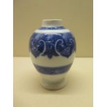 A Chinese soft paste porcelain tea caddy decorated in a blue and white scale and floral design, 12cm