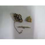 A hallmarked 15ct yellow gold brooch approx 4.7 grams and two gilt metal brooches, 5cm wide,