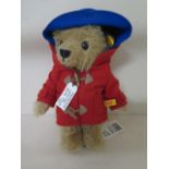 A Steiff Paddington 22 teddy bear with red coat