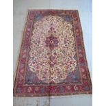 A hand knotted woollen Kashan rug, 2.05m x 1.35m, in good condition