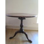 A good Georgian tilt top tripod side table with a column birdcage action, the one piece top is