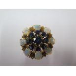 A yellow gold opal and sapphire cluster ring, size P/Q, head approx 25mm diameter, hallmarks worn,