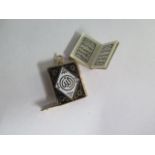 A 14ct gold enamel miniature Quran pendant holder, 2cm tall, pendant weight approx 2.8 grams,