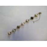 A hallmarked 9ct yellow gold cameo bracelet, 18cm long, some small wear, chain loose, total weight