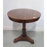 A Victorian rosewood tilt top side table on a tripartite platform base, 69cm tall x 60cm diameter