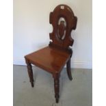 A Victorian mahogany hall chair in good polished condition