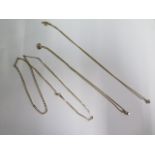 Three 9ct yellow gold necklaces, 2 with pendants, longest chain 50 cm, total weight approx 8.6 grams