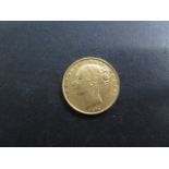 A Victorian Shield back bun head gold full sovereign dated 1872