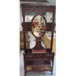 An Edwardian inlaid mahogany mirrorback hall stand with a glove drawer, 215cm tall x 91cm wide x