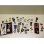 An assortment of medals, commemorative medallions etc.