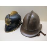 A German Pickelhaube style Fire Brigade helmet and a brass helmet, general wear to both but both
