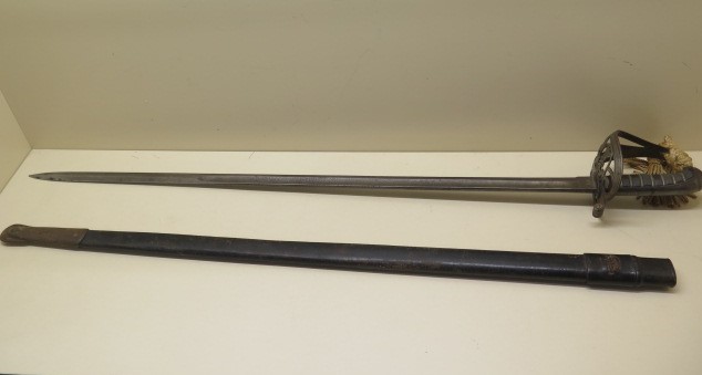 An Officers sword with leather scabbard, blade 83cm long, some wear to grip and scabbard, some