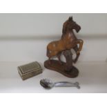 A Carol Boyer serving spoon, 23cm long, an inlaid trinket box and a carved wooden horse, 39cm tall