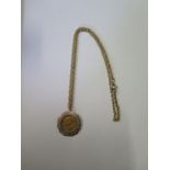 Edward VII gold half sovereign on a gilt metal chain, total approx 13.2 grams