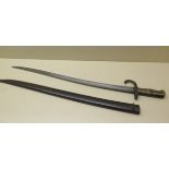 A 19th century French bayonet with 57cm blade numbered P 18572 with a scabbard, some pitting but