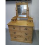 A late Victorian stripped pine 4 drawer dressing chest with 2 small trinket drawers, 152cm tall x