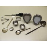 Assorted silver items including two heart picture frames 8cm tall and a base metal tap, weighable