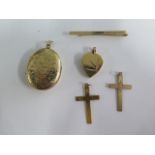 Two 9ct gold crucifixes, a 9ct tie clip and 2 9ct lockets, total weight approx 19.6 grams