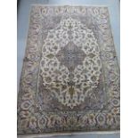 A hand knotted woollen fine Kashan rug, 2.10cm x 1.48cm, generally good, some wear to fringes