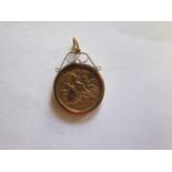 A George V gold half sovereign dated 1912 in a 9ct pendant mount, approx 5.6 grams