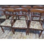 A set of seven 19th century mahogany dining chairs with drop in seats including a scroll arm carver,