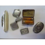 Two silver vestas, a silver watch case, a silver buff and a silver bottle top, weighable silver