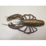 An interesting brass / bronze lobster inkwell Rd 136509, 32cm long, missing bottles but generally