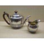 A Victorian silver tea pot and milk jug, London 1876/77 maker FB Frederick Brasted, approx 24.4 troy