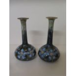 A pair of Royal Doulton single stem vases, 17cm tall, both good condition