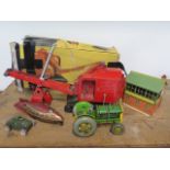 A Triang tin plate excavator, a friction drive space ship, a Arnold tank, a tin plate tractor and