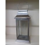 A large stainless steel lantern, 83cm tall x 30cm x 22cm