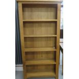 An oak bookcase with 4 fixed shelves, 180cm tall x 90cm x 30cm