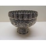 A 19th century South East Asian silver bowl decorated with mythological beings and fishes, 14cm x