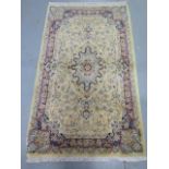 A hand knotted woollen Tabriz rug, 1.64cm x 1.00m, generally good