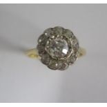 A yellow gold and platinum diamond cluster ring, centre diamond approx 0.60ct, head approx 12mm