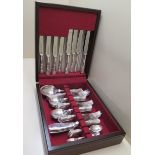 A silver 925 6 setting kings pattern canteen of cutlery with 2 serving spoons, Sheffield, maker WT