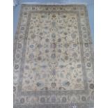 A hand knotted woollen fine Tabriz, silk inlaid rug, 2.05cm x 1.50cm, generally good