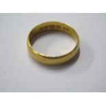 A hallmarked 22ct yellow gold band ring, size Q, approx 4.5 grams, some small usage marks