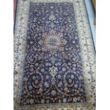 A hand knotted woollen fine Nain, silk inlaid rug, 2.15cm x 1.65cm, generally good