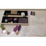 A group of four WWII medals with badges, bible and paperwork relating to Capt P N Thompson also a